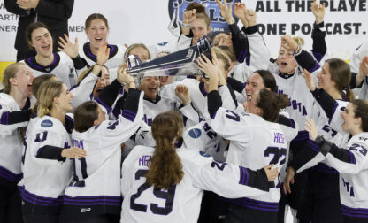 FILE - Minnesota players celebrate with the Walter Cup after defeating Boston to win the PWHL Walter Cup, May 29, 2024, in Lowell, Mass. (AP Photo/Mary Schwalm, File)