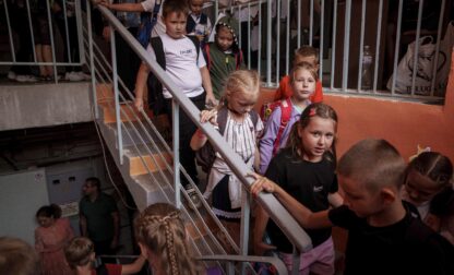 Children from Gymnasium No. 6 head to a basement set up with classrooms during an air alert in Zaporizhzhia, Ukraine, Sept. 3, 2024. The city is building a dozen subterranean schools designed to be radiation- and bomb-proof. (AP Photo/Evgeniy Maloletka)