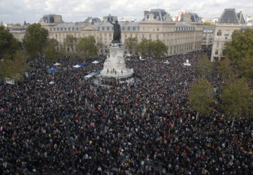 FILE - Hundreds of people gather on Republique square during a demonstration Sunday Oct. 18, 2020 in Paris, in support of freedom of speech and to pay tribute to French history teacher Samuel Paty. (AP Photo/Michel Euler, File)