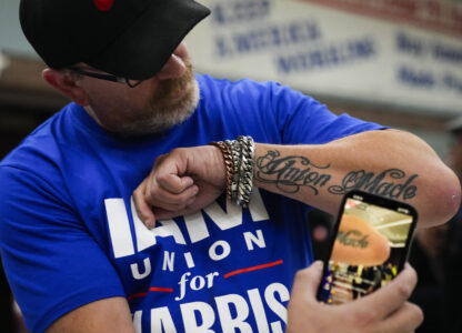 Ed Lutgen shows off his tattoo while waiting to hear the results of the union vote on a new contract offer from Boeing, Monday, Nov. 4, 2024, at IAM District 751 Union Hall in Seattle. (AP Photo/Lindsey Wasson)