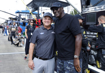 Bob Jenkins, owner of Front Row Motorsports and Co-Owner Michael Jordan, of 23XI Racing, pose before a NASCAR Cup Series auto race at Talladega Superspeedway, Sunday, Oct. 6, 2024, in Talladega, Ala. (AP Photo/ Butch Dill)