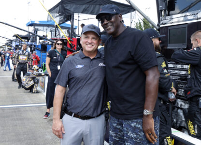 Bob Jenkins, owner of Front Row Motorsports and Co-Owner Michael Jordan, of 23XI Racing, pose before a NASCAR Cup Series auto race at Talladega Superspeedway, Sunday, Oct. 6, 2024, in Talladega, Ala. (AP Photo/ Butch Dill)