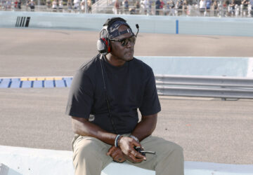 Car owner Michael Jordan watches from the pits during a NASCAR Cup Series auto race at Homestead-Miami Speedway in Homestead, Fla., Sunday, Oct. 27, 2024. (AP Photo/Terry Renna)