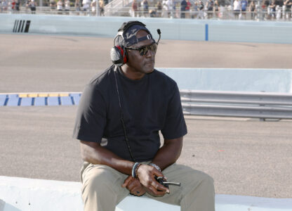 Car owner Michael Jordan watches from the pits during a NASCAR Cup Series auto race at Homestead-Miami Speedway in Homestead, Fla., Sunday, Oct. 27, 2024. (AP Photo/Terry Renna)