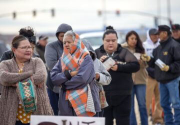 Voters wait in line to cast their ballots outside a polling station on the Navajo Nation in Chinle, Ariz., on Election Day, Tuesday, Nov. 5, 2024. (AP Photo/Andres Leighton)