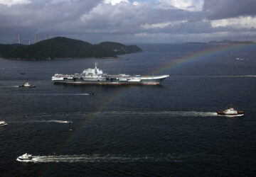 FILE- The Liaoning, China's first conventionally powered aircraft carrier, sails into Hong Kong for port call, on July 7, 2017, to celebrate the 20th anniversary of the People's Liberation Army (PLA) garrison's presence in the semi-autonomous Chinese city and former British colony. (AP Photo/Kin Cheung, File)