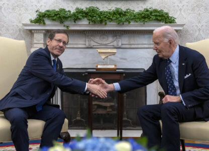 President Joe Biden shakes hands with Israel's President Isaac Herzog, left, during a meeting in the Oval Office of the White House in Washington, Tuesday, Nov. 12, 2024. (AP Photo/Ben Curtis)