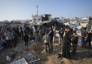 FILE - Palestinians gather at the site of an Israeli strike in the courtyard of the Al-Aqsa Hospital where displaced people live in tents, in Deir al-Balah, Gaza Strip, on Nov. 9, 2024. (AP Photo/Abdel Kareem Hana, File)