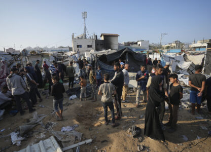 FILE - Palestinians gather at the site of an Israeli strike in the courtyard of the Al-Aqsa Hospital where displaced people live in tents, in Deir al-Balah, Gaza Strip, on Nov. 9, 2024. (AP Photo/Abdel Kareem Hana, File)