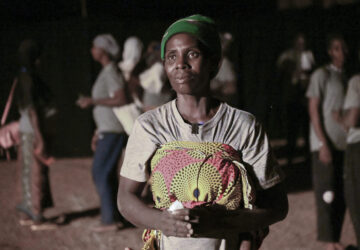 Fanta Charlotte Dabone, a mother of three who fled her village after it was attacked by extremists, participates in Recreatrales, an international theater festival held in Ouagadougou, Burkina Faso, Monday, Oct. 28, 2024. (AP Photo/Kilaye Bationo)