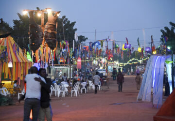 People gather for Recreatrales, an international theater festival held in Ouagadougou, Burkina Faso, Monday, Oct. 28, 2024. (AP Photo/Kilaye Bationo)