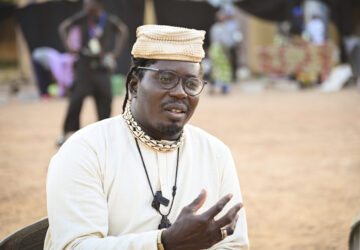 Aristide Tarnagda, the artistic director of Recreatrales, an international theater festival held in Ouagadougou, Burkina Faso, speaks to reporters Monday, Oct. 28, 2024. (AP Photo/Kilaye Bationo)