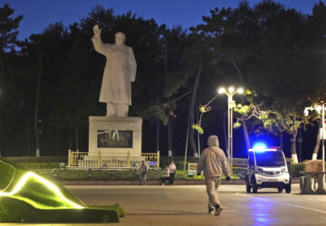 Pedestrian walks by a statue of Chairman Mao Zedong in Changchun, a city located in northwestern China's industrial rustbelt zone Jilin province on Oct. 12, 2024. (AP Photo/Dake Kang)