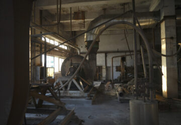 Abandoned machinery sits in an abandoned factory of Dacheng Shenghua Feed company in Changchun, China, a city located in northwestern China's industrial rustbelt zone Jilin province on Oct. 12, 2024. (AP Photo/Dake Kang)