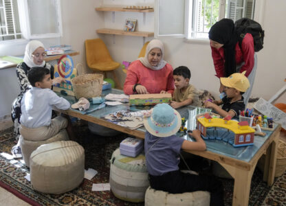 Palestinian children who were brought to Lebanon from the Gaza Strip for treatment, play at a summer camp in Beirut, Lebanon, Friday, Aug. 30, 2024. (AP Photo/Bilal Hussein)