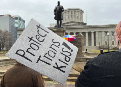 FILE - Protesters advocating for transgender rights and healthcare stand outside of the Ohio Statehouse, Jan. 24, 2024, in Columbus, Ohio. (AP Photo/Patrick Orsagost, File)