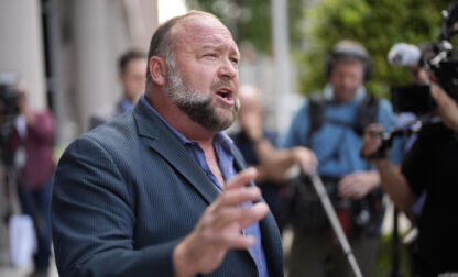 FILE - Right-wing conspiracy theorist Alex Jones speaks to the media after arriving at the federal courthouse for a hearing in front of a bankruptcy judge, Friday, June 14, 2024, in Houston. (AP Photo/David J. Phillip, File)