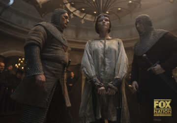 This image released by Fox Nation shows Liah O'Prey as Joan of Arc, center, in a scene from 