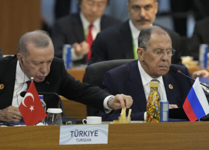 Turkey's President Recep Tayyip Erdogan, left, and Russia's Foreign Minister Sergey Lavrov attend the G20 Summit leaders meeting in Rio de Janeiro, Monday, Nov. 18, 2024. (AP Photo/Eraldo Peres)