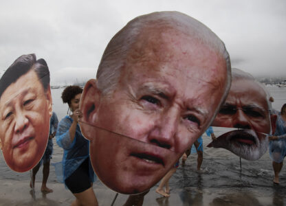 Activists from a Brazilian Indigenous movement hold cutouts of Chinese President Xi Jinping, from left, President Joe Biden and Indian Prime Minister Narendra Modi, during a protest aimed at drawing the attention on the global climate crisis to leaders attending the upcoming G20 Summit, at Botafogo Beach in Rio de Janeiro, Saturday, Nov. 16, 2024. (AP Photo/Bruna Prado)