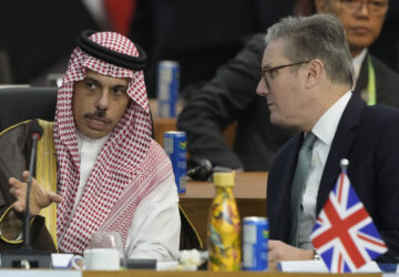 Britain's Prime Minister Keir Starmer, right, and Saudi Arabia's Foreign Minister Prince Faisal bin Farhan Al-Saud talk during the G20 Summit leaders meeting in Rio de Janeiro, Monday, Nov. 18, 2024. (AP Photo/Eraldo Peres)