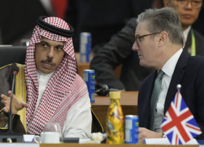 Britain's Prime Minister Keir Starmer, right, and Saudi Arabia's Foreign Minister Prince Faisal bin Farhan Al-Saud talk during the G20 Summit leaders meeting in Rio de Janeiro, Monday, Nov. 18, 2024. (AP Photo/Eraldo Peres)