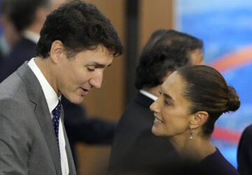 Canada's Prime Minister Justin Trudeau, left, and Mexico's President Claudia Sheinbaum talk during the G20 Summit leaders meeting in Rio de Janeiro, Monday, Nov. 18, 2024. (AP Photo/Eraldo Peres)