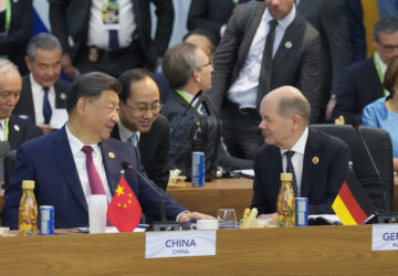 China's President Xi Jinping, left, talks with Germany's Chancellor Olaf Scholz during the G20 Summit leaders meeting in Rio de Janeiro, Monday, Nov. 18, 2024. (AP Photo/Eraldo Peres)