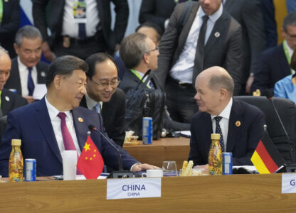 China's President Xi Jinping, left, talks with Germany's Chancellor Olaf Scholz during the G20 Summit leaders meeting in Rio de Janeiro, Monday, Nov. 18, 2024. (AP Photo/Eraldo Peres)