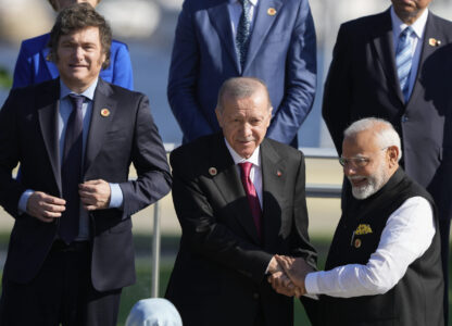 Argentina's President Javier Milei, left, Turkey's President Recep Tayyip Erdogan, center, and India's Prime Minister Narendra Modi prepare for a group photo at the G20 Summit in Rio de Janeiro, Monday, Nov. 18, 2024. (AP Photo/Eraldo Peres)