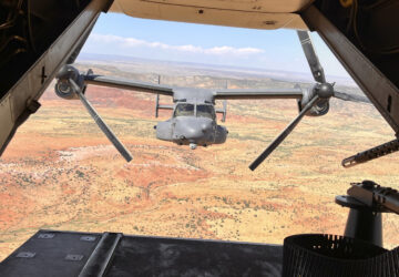 Two Air Force Special Operations Command CV-22B Ospreys fly low and fast in formation on a training range named the Hornet at Cannon Air Force Base, N.M., Oct. 9, 2024. (AP Photo/Tara Copp)