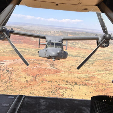 Two Air Force Special Operations Command CV-22B Ospreys fly low and fast in formation on a training range named the Hornet at Cannon Air Force Base, N.M., Oct. 9, 2024. (AP Photo/Tara Copp)