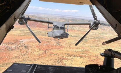 Two Air Force Special Operations Command CV-22B Ospreys fly low and fast in formation on a training range named the Hornet at Cannon Air Force Base, N.M., Oct. 9, 2024. (AP Photo/Tara Copp)