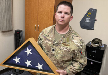 Lt. Col. Seth Buckley, an Osprey squadron commander at Cannon Air Force Base, N.M., who lost his brother in an Air Force Special Operations Command MC-130H crash (AFSOC) when he was still in high school, poses for a photo in his office Oct. 8, 2024.. Buckley says, 