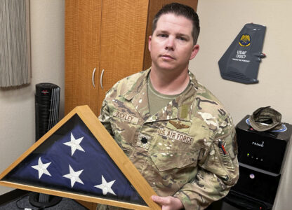 Lt. Col. Seth Buckley, an Osprey squadron commander at Cannon Air Force Base, N.M., who lost his brother in an Air Force Special Operations Command MC-130H crash (AFSOC) when he was still in high school, poses for a photo in his office Oct. 8, 2024.. Buckley says, 