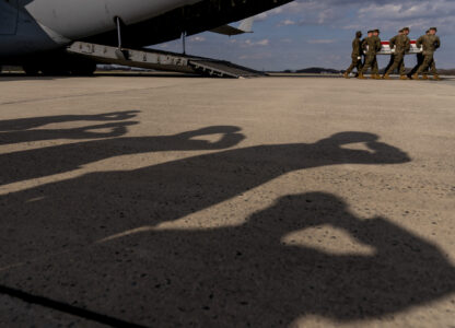 FILE - A U.S. Marine Corps carry team moves a transfer case containing the remains of Gunnery Sgt. James W. Speedy of Cambridge, Ohio, during a casualty return, Friday, March 25, 2022, at Dover Air Force Base. According to the Department of Defense, Speedy died March 18, in an Osprey crash during a NATO exercise in Norway. (AP Photo/Andrew Harnik)