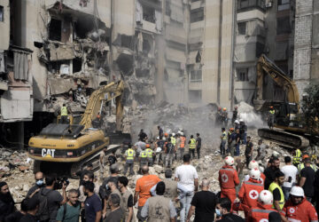 FILE - Emergency workers use excavators to clear the rubble at the site of an Israeli strike in Beirut's southern suburbs, on Sept. 21, 2024. (AP Photo/Bilal Hussein, File)