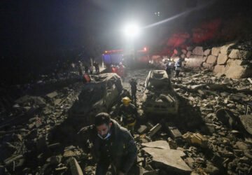 FILE - Rescuers search for survivors after an Israeli airstrike in Baalchmay village east of Beirut, Lebanon, on Nov. 12, 2024. (AP Photo/Hassan Ammar, File)