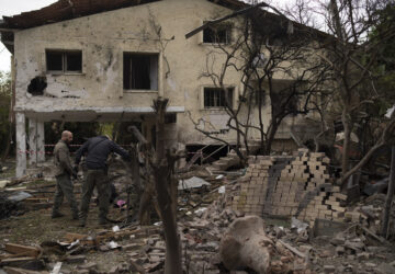 Members of the Israeli forces inspect a site following a rocket fired from Lebanon hit an area in Rinatya, outskirts of Tel Aviv, Israel, Sunday, Nov. 24, 2024. (AP Photo/Leo Correa)