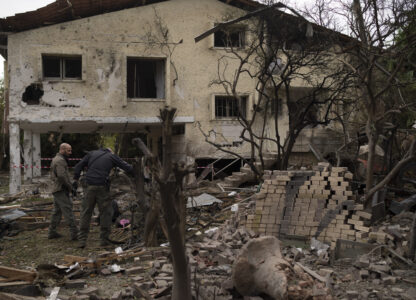 Members of the Israeli forces inspect a site following a rocket fired from Lebanon hit an area in Rinatya, outskirts of Tel Aviv, Israel, Sunday, Nov. 24, 2024. (AP Photo/Leo Correa)