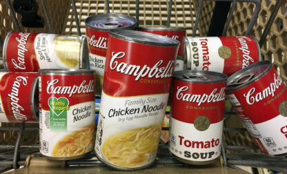 FILE - This May 23, 2017, file photo shows a variety of Campbell's soups in a grocery cart at a store in Phoenix. (AP Photo/Ross D. Franklin, File)