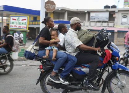 Residents flee their homes to escape gang violence in the Nazon neighborhood of Port-au-Prince, Haiti, Thursday, Nov. 14, 2024. (AP Photo/Odelyn Joseph)