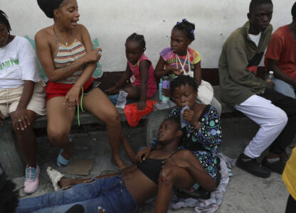 An asthmatic girl rests as she takes refuge in a private school serving as a shelter for residents fleeing gang violence in the Nazon neighborhood, in Port-au-Prince, Haiti, Thursday, Nov. 14, 2024. (AP Photo/Odelyn Joseph)