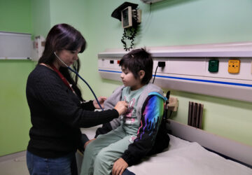 Doctor Dolly Noun, a pediatric hematologist and oncologist, checks Carol Zeghayer, 9, a girl who suffers from leukaemia ahead of her treatment at the Children's Cancer Center of Lebanon, in Beirut, Lebanon, Friday, Nov. 15, 2024. (AP Photo/Hussein Malla)