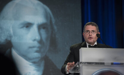 FILE - An image of former President James Madison is seen behind Leonard Leo, as he speaks at the National Lawyers Convention in Washington, in this Nov. 16, 2017 file photo. (AP Photo/Sait Serkan Gurbuz, file)