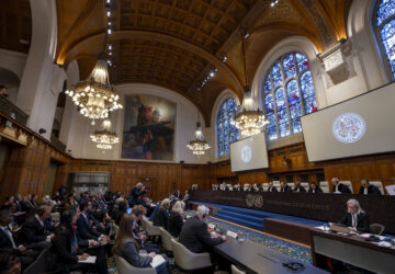 Judges are seated as the International Court of Justice in The Hague, Netherlands, opens hearings into what countries worldwide are legally required to do to combat climate change and help vulnerable nations fight its devastating impact, Monday, Dec. 2, 2024. (AP Photo/Peter Dejong)