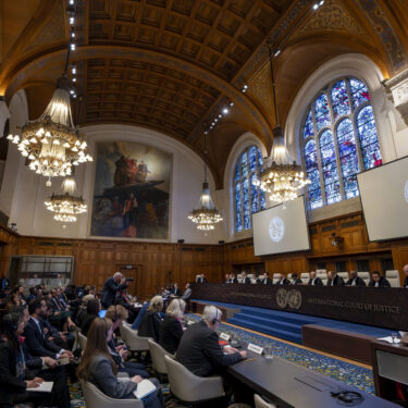 Judges are seated as the International Court of Justice in The Hague, Netherlands, opens hearings into what countries worldwide are legally required to do to combat climate change and help vulnerable nations fight its devastating impact, Monday, Dec. 2, 2024. (AP Photo/Peter Dejong)