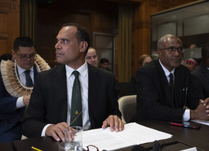 Vanuatu's special climate envoy Ralph Regenvanu prepares to speak as the International Court of Justice in The Hague, Netherlands, opens hearings into what countries worldwide are legally required to do to combat climate change and help vulnerable nations fight its devastating impact, Monday, Dec. 2, 2024. (AP Photo/Peter Dejong)