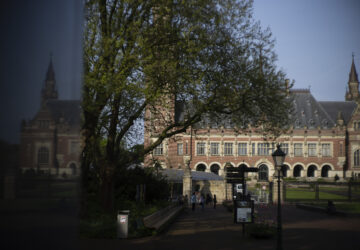 FILE - The Peace Palace housing the World Court, or International Court of Justice, is reflected in a monument in The Hague, Netherlands, Wednesday, May 1, 2024. (AP Photo/Peter Dejong, File)