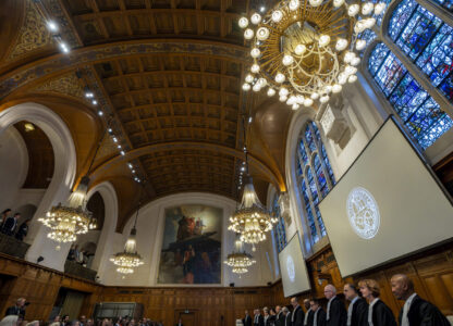 Judges at the International Court of Justice in The Hague, Netherlands, prepare to open hearings into what countries worldwide are legally required to do to combat climate change and help vulnerable nations fight its devastating impact, Monday, Dec. 2, 2024. (AP Photo/Peter Dejong)